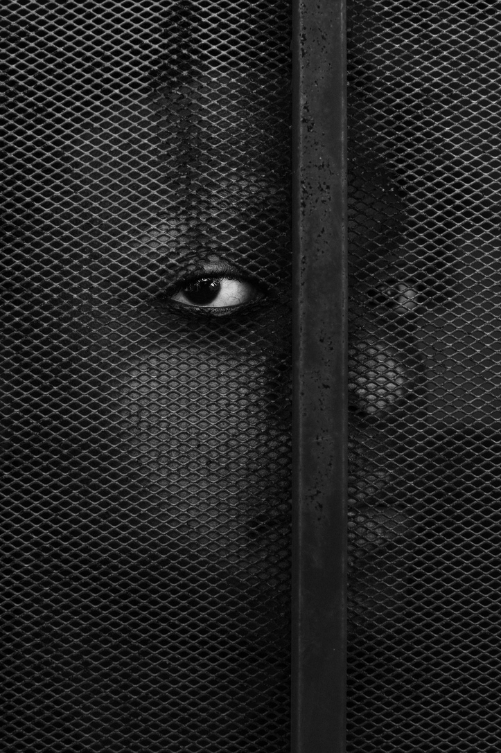 Black face through fence, Gioncarlo Valentine©2020, journal of wild culture